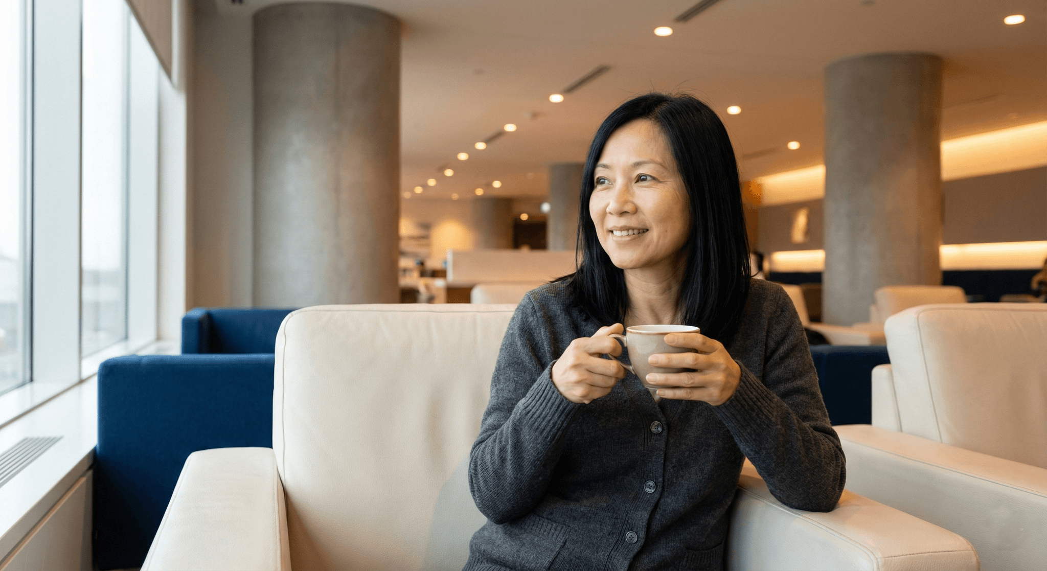Woman finding calm at airport lounge before flight